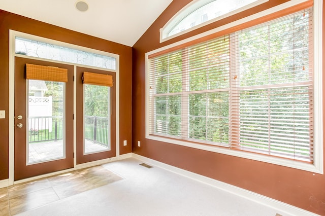 10725 Toledo Ln N, Brooklyn Park, MN 55443 - doorway featuring vaulted ceiling and carpet