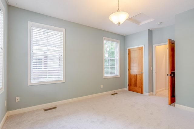 10725 Toledo Ln N, Brooklyn Park, MN 55443 - unfurnished bedroom featuring light carpet