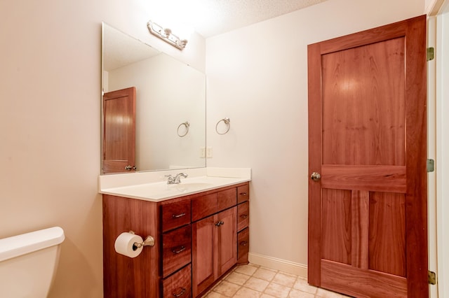 10725 Toledo Ln N, Brooklyn Park, MN 55443 - half bathroom featuring vanity and tile patterned flooring