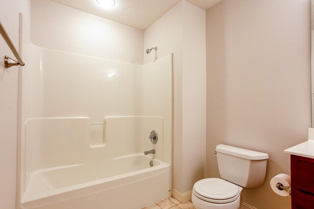 10725 Toledo Ln N, Brooklyn Park, MN 55443 - full bath featuring vanity, a textured ceiling, shower / bath combination, and tile patterned floors