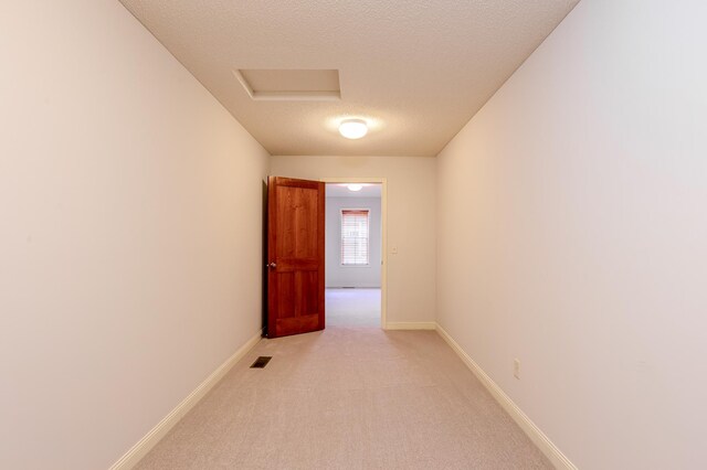 10725 Toledo Ln N, Brooklyn Park, MN 55443 - empty room with a textured ceiling and light carpet
