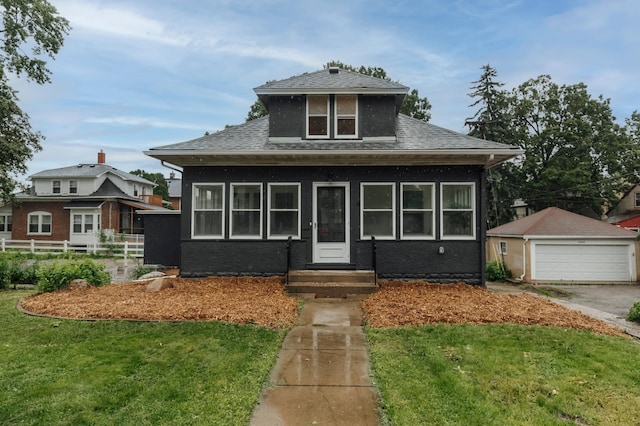 212 Diamond Lake Rd, Minneapolis, MN 55419 - bungalow-style house featuring a garage, roof with shingles, and an outbuilding