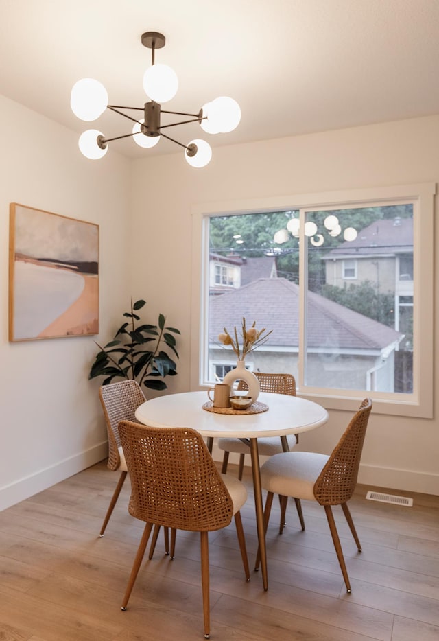 212 Diamond Lake Rd, Minneapolis, MN 55419 - dining space with a chandelier and light wood-style flooring