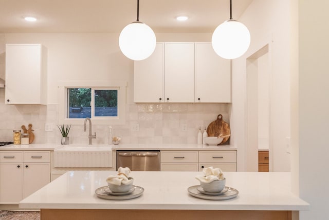 212 Diamond Lake Rd, Minneapolis, MN 55419 - kitchen with stainless steel dishwasher, decorative backsplash, light countertops, hanging light fixtures, and recessed lighting