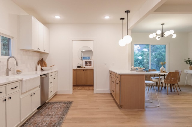 212 Diamond Lake Rd, Minneapolis, MN 55419 - kitchen featuring stainless steel dishwasher, light wood finished floors, a peninsula, plenty of natural light, and recessed lighting