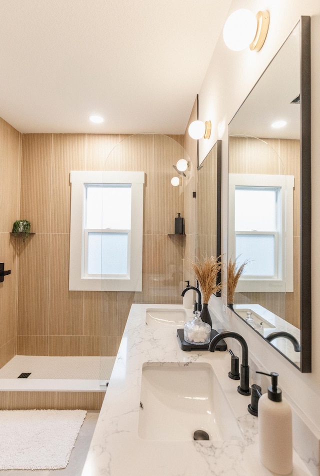 212 Diamond Lake Rd, Minneapolis, MN 55419 - bathroom featuring double vanity and tiled shower