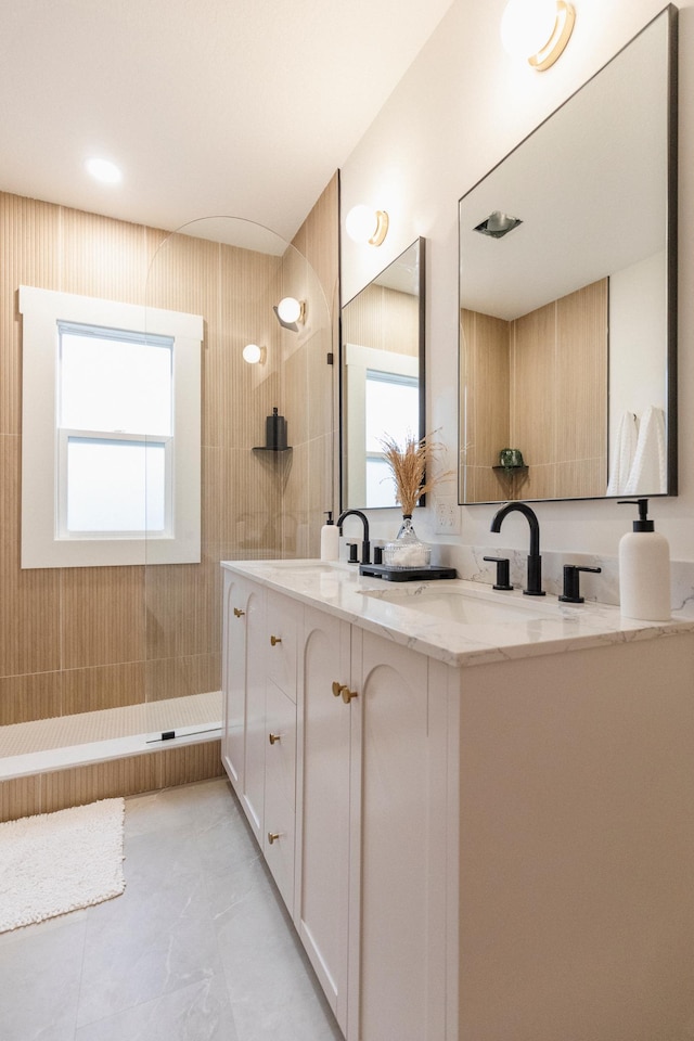 212 Diamond Lake Rd, Minneapolis, MN 55419 - bathroom featuring double vanity, a walk in shower, plenty of natural light, and tile patterned floors