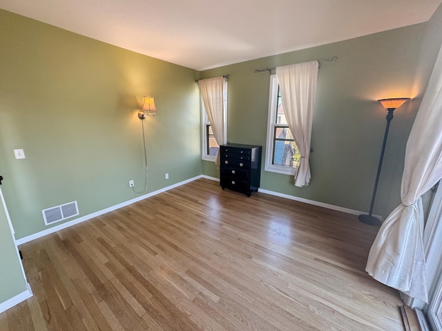 220 Mackubin St Unit 220, Saint Paul, MN 55102 - empty room featuring wood finished floors and baseboards