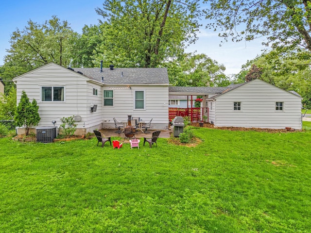 8313 Stevens Ave S, Bloomington, MN 55420 - back of property with a yard, a shingled roof, and a patio