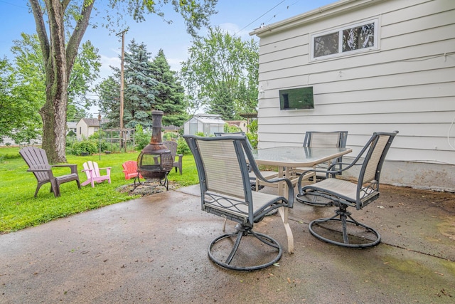 8313 Stevens Ave S, Bloomington, MN 55420 - view of patio with a fire pit, outdoor dining area, and a shed