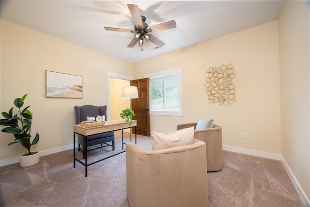 office space featuring light colored carpet and ceiling fan