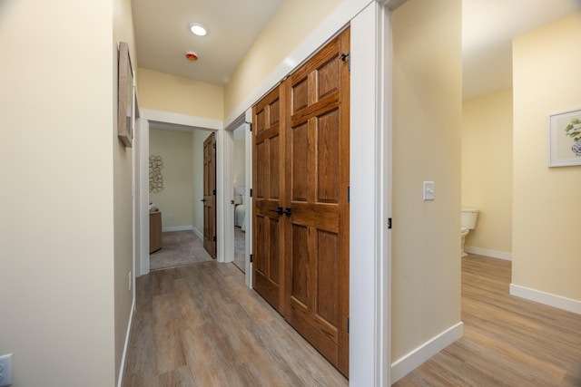 hallway with light wood finished floors