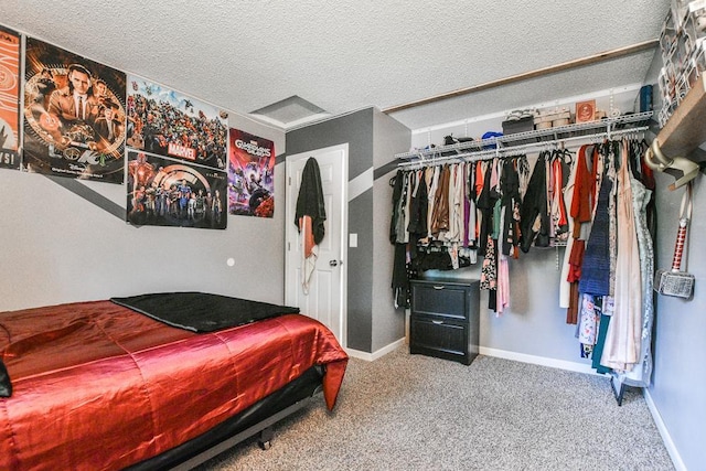 7097 Robinwood Bay, Woodbury, MN 55125 - bedroom featuring a closet, carpet flooring, and a textured ceiling