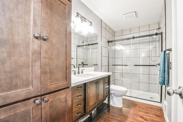 7097 Robinwood Bay, Woodbury, MN 55125 - bathroom with wood finished floors, vanity, a stall shower, and tile walls