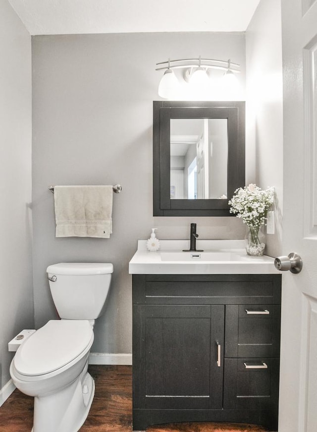 7097 Robinwood Bay, Woodbury, MN 55125 - half bathroom with vanity and wood finished floors