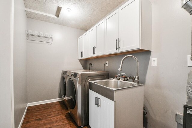 7097 Robinwood Bay, Woodbury, MN 55125 - washroom with washer and clothes dryer, cabinet space, dark wood-style floors, and a textured ceiling