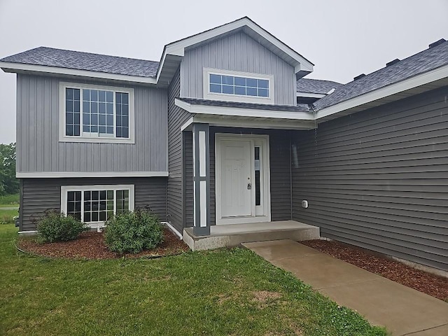 591 Alaska Loop, Cambridge, MN 55008 - doorway to property featuring a yard and a shingled roof