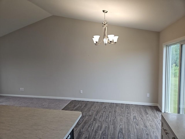 591 Alaska Loop, Cambridge, MN 55008 - unfurnished dining area with a chandelier, dark wood-type flooring, and lofted ceiling
