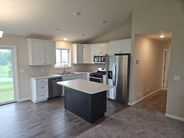 591 Alaska Loop, Cambridge, MN 55008 - kitchen with stainless steel appliances, light countertops, white cabinetry, a kitchen island, and lofted ceiling