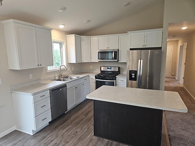 591 Alaska Loop, Cambridge, MN 55008 - kitchen featuring appliances with stainless steel finishes, light countertops, white cabinetry, lofted ceiling, and dark wood-type flooring