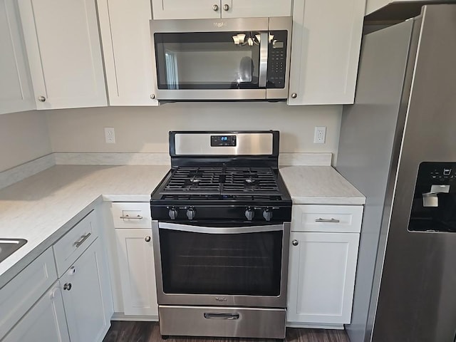 591 Alaska Loop, Cambridge, MN 55008 - kitchen featuring appliances with stainless steel finishes, white cabinetry, and light countertops