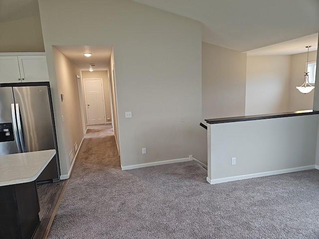 591 Alaska Loop, Cambridge, MN 55008 - kitchen with stainless steel refrigerator with ice dispenser, dark carpet, and light countertops