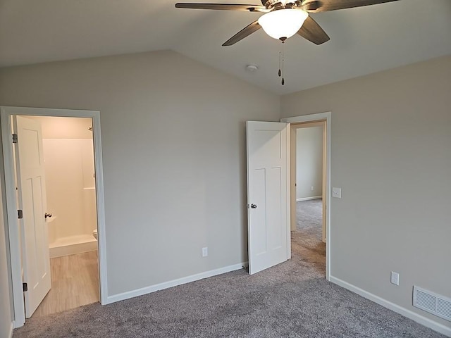 591 Alaska Loop, Cambridge, MN 55008 - unfurnished bedroom featuring carpet, vaulted ceiling, ensuite bath, and a ceiling fan