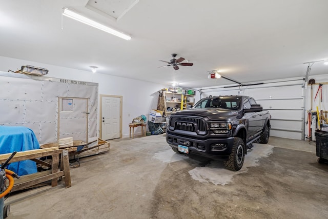 23148 Glenhaven Dr, Nevis, MN 56467 - garage featuring ceiling fan and a garage door opener