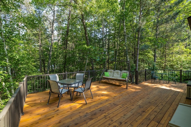 23148 Glenhaven Dr, Nevis, MN 56467 - wooden terrace with outdoor dining space and an outdoor living space