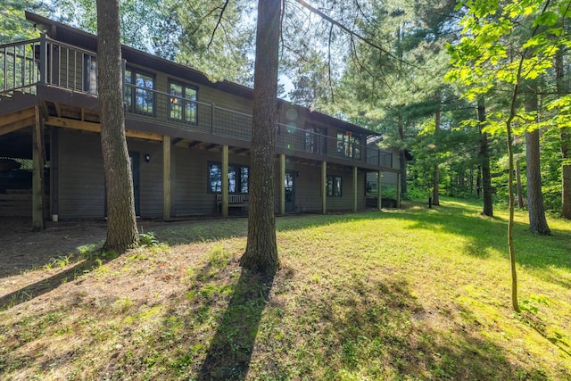 23148 Glenhaven Dr, Nevis, MN 56467 - rear view of property with a yard and a wooden deck