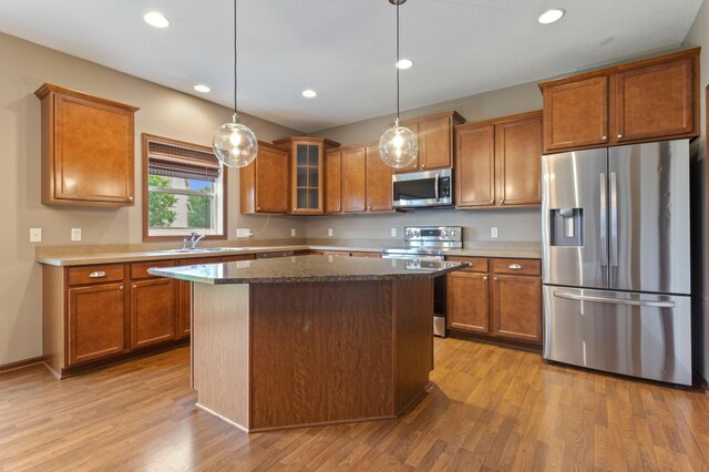 17393 54th St NE, Otsego, MN 55374 - kitchen featuring appliances with stainless steel finishes, brown cabinets, and recessed lighting