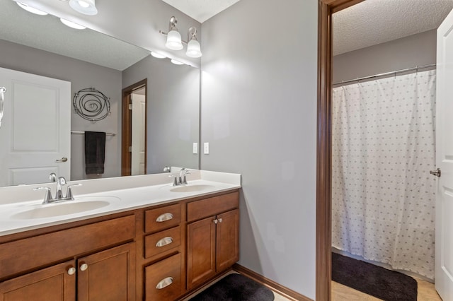 17393 54th St NE, Otsego, MN 55374 - bathroom featuring double vanity, a textured ceiling, and a shower with curtain