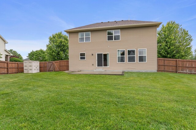 17393 54th St NE, Otsego, MN 55374 - rear view of house featuring a fenced backyard, a patio, and a storage shed