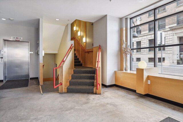 270 4th St E Unit 509, Saint Paul, MN 55101 - stairway with elevator, finished concrete floors, and recessed lighting
