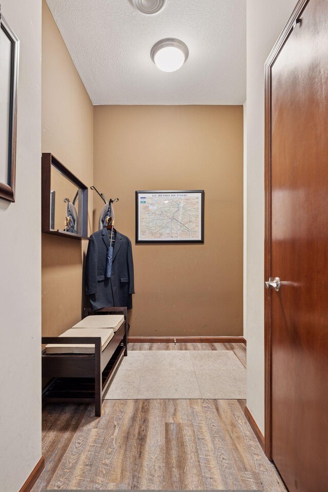 270 4th St E Unit 509, Saint Paul, MN 55101 - mudroom featuring wood finished floors and a textured ceiling