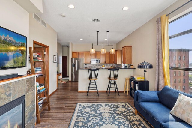 270 4th St E Unit 509, Saint Paul, MN 55101 - living room with dark wood-style flooring, recessed lighting, and a tile fireplace