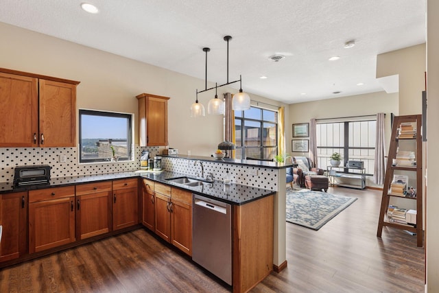 270 4th St E Unit 509, Saint Paul, MN 55101 - kitchen featuring stainless steel dishwasher, brown cabinetry, dark wood-type flooring, and recessed lighting