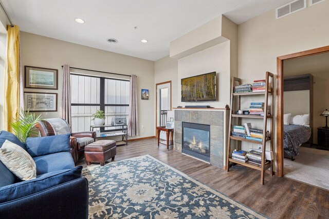 270 4th St E Unit 509, Saint Paul, MN 55101 - living room featuring wood finished floors, a tile fireplace, and recessed lighting