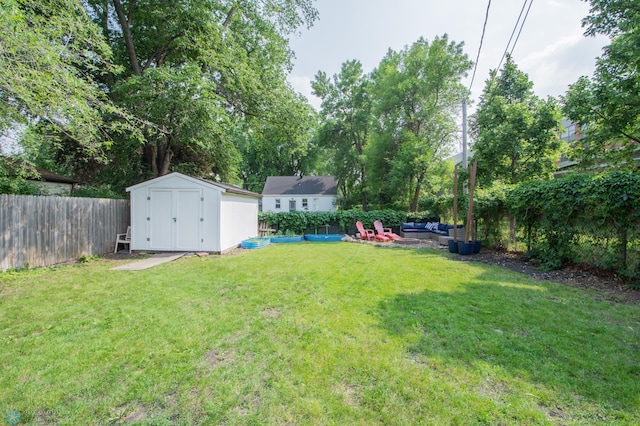 1530 11th Ave S, Fargo, ND 58103 - fenced backyard with outdoor lounge area and a storage shed