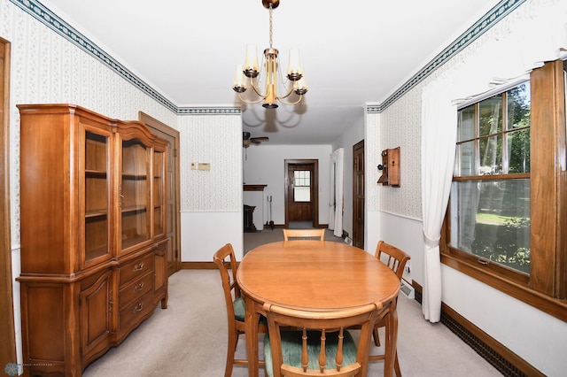 1321 4th St N, Fargo, ND 58102 - dining space featuring wallpapered walls, a chandelier, light carpet, and ornamental molding