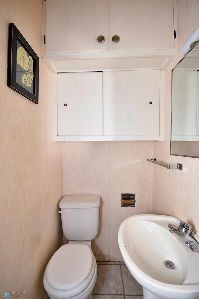 1321 4th St N, Fargo, ND 58102 - bathroom with toilet and tile patterned flooring