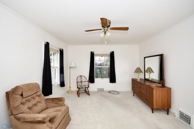 1321 4th St N, Fargo, ND 58102 - sitting room featuring light colored carpet, ceiling fan, and ornamental molding