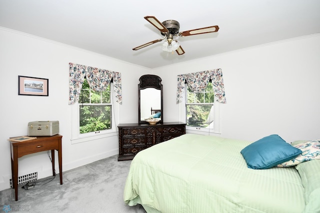 1321 4th St N, Fargo, ND 58102 - bedroom with multiple windows, light carpet, crown molding, and a ceiling fan