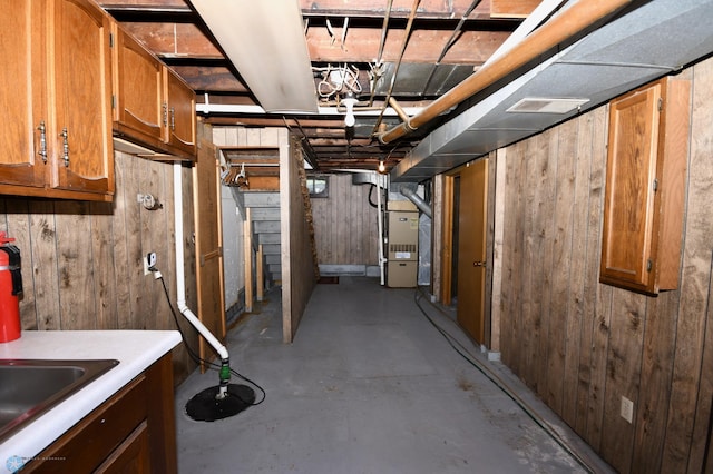 1321 4th St N, Fargo, ND 58102 - unfinished basement with heating unit and wood walls