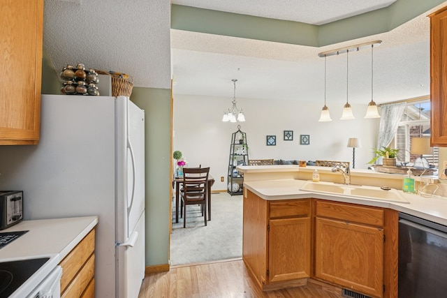 8829 Branson Dr Unit 46, Inver Grove Heights, MN 55076 - kitchen featuring dishwasher, a peninsula, hanging light fixtures, light wood-style flooring, and light countertops