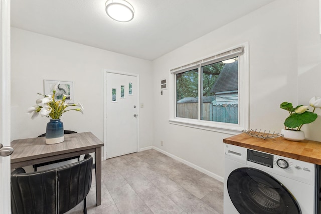 4714 Aldrich Ave N, Minneapolis, MN 55430 - foyer featuring washer / clothes dryer and baseboards