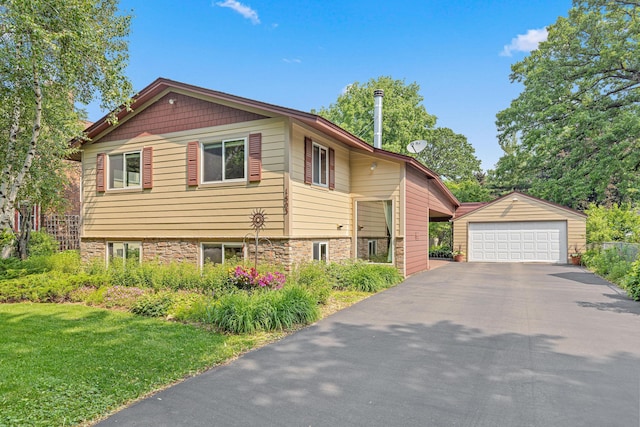 1803 Hubbard Ave, Saint Paul, MN 55104 - view of front of home with an outbuilding, a detached garage, and a front lawn