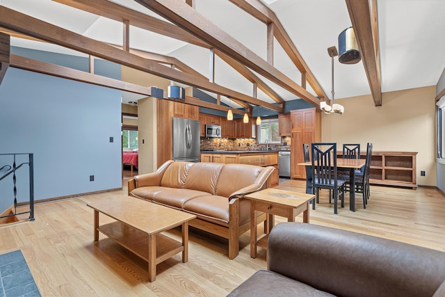 1803 Hubbard Ave, Saint Paul, MN 55104 - living area featuring beam ceiling, light wood-style flooring, high vaulted ceiling, and a chandelier