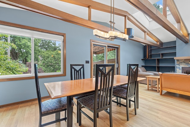 1803 Hubbard Ave, Saint Paul, MN 55104 - dining area featuring light wood-style floors, a chandelier, and vaulted ceiling