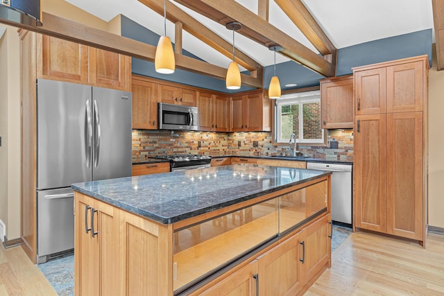 1803 Hubbard Ave, Saint Paul, MN 55104 - kitchen featuring appliances with stainless steel finishes, light wood finished floors, tasteful backsplash, and dark stone counters